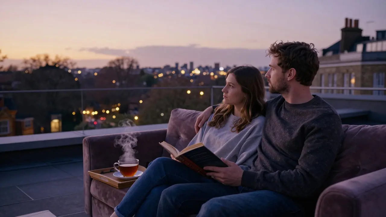 Two people sitting together on a rooftop terrace at dusk, watching London lights emerge over Hyde Park.